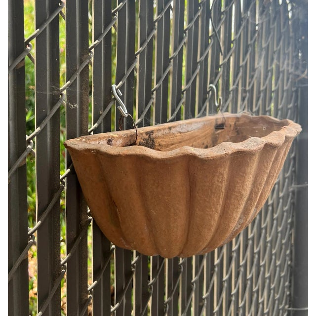 Beautiful vintage Italian Terracotta wall pocket half vase with a stylized shell 3 available External dimensions are: 14"...