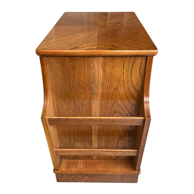 A charming vintage telephone table by Lane Altavista, crafted in warm golden oak and showcasing a striking sunburst...