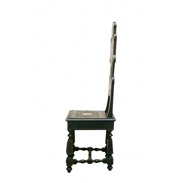 A prestigious ceremonial chair, historically referred to as a stool due to its contoured backrest and rigid wooden seat,...