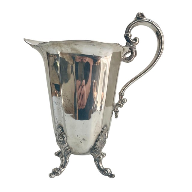 Gorgeous tall, elegant formed with a prominent handle and ice lip designed for easier pouring. The pitcher stands on four...
