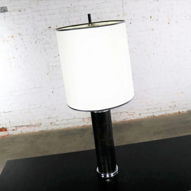 Handsome International Style table lamp after the designs of Walter von Nessen. Great cylindrical shape in chrome and...