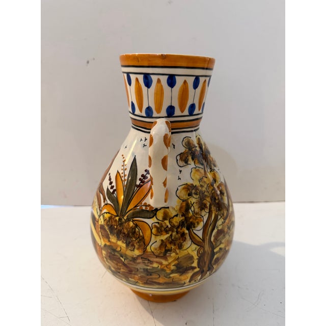 Charming pair of vintage hand-painted ceramic vessels featuring a whimsical pastoral scene with fox motifs, foliage, and...