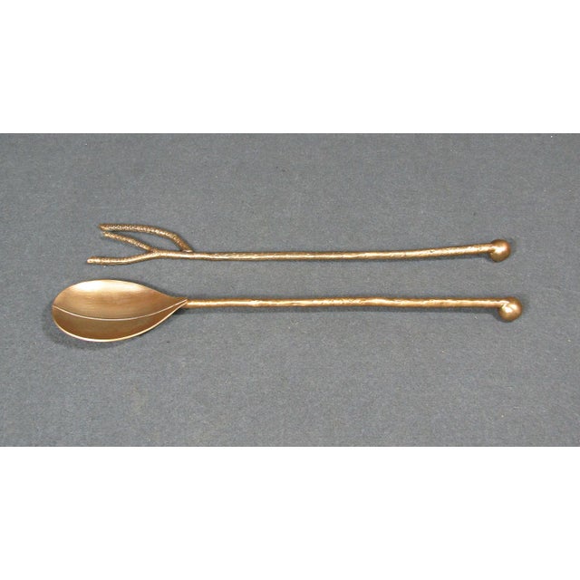 A striking Grant Dawson “Mangrove Collection” salad serving set, featuring a leaf-shaped serving spoon and coordinating...