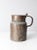 This antique copper jug pitcher features a beautifully aged surface and a generously sized handle, offering both charm and...
