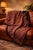 Large antique paisley shawl in the classic Kashmir style, featuring intricate boteh motifs in rich reds, rust, and...