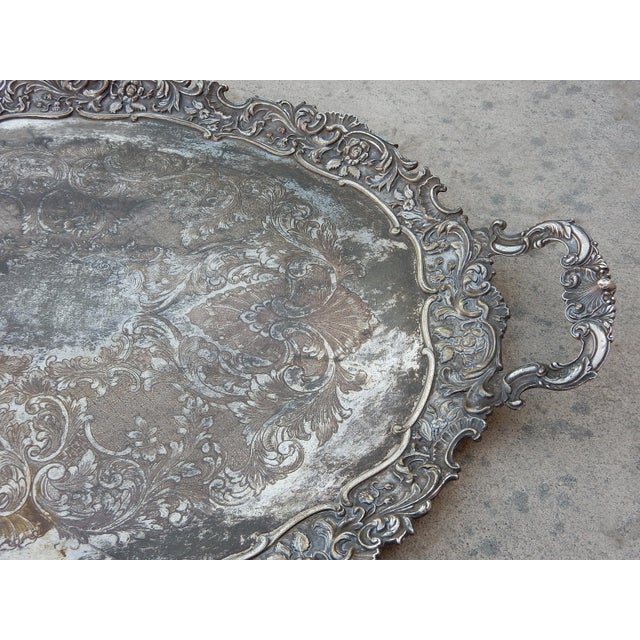 Extremely large serving tray with ornate edge and handles. Exceptional detail. Measures 30-1/2" wide X 21" deep X 2-1/2"....