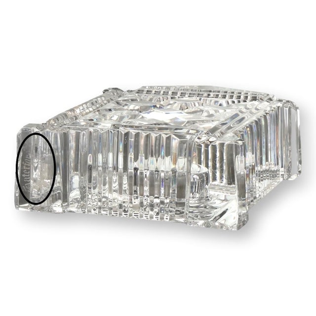 Elegant Waterford crystal clock with a classic architectural design, featuring intricate cut detailing and a gold-tone...