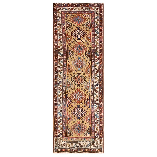 Antique Caucasian - Kuba rug. Measures: 3'6"x 10'0". Yellow is a popular field color for eastern Caucasian rugs, and this...