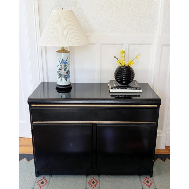 Vintage mid-century hand-painted ceramic and brass floral lamp on wood stand. Lovely colors, and sweet floral motif. Made...