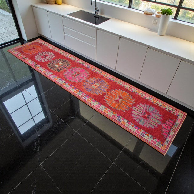 Handwoven in Western Anatolia during the 1970s, this vintage Oushak runner showcases masterful Turkish craftsmanship and...