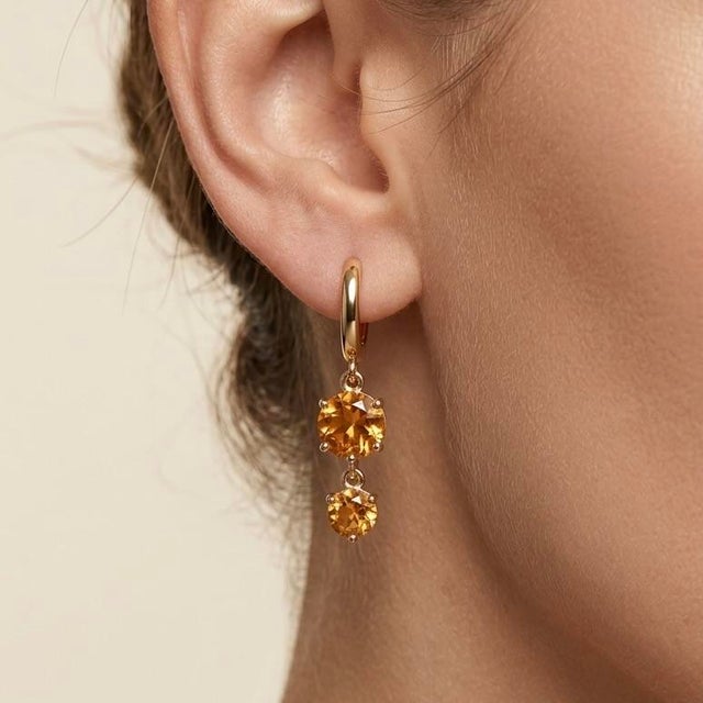 Elevate your everyday style with these radiant double-drop huggie earrings. Masterfully crafted, each earring features a...
