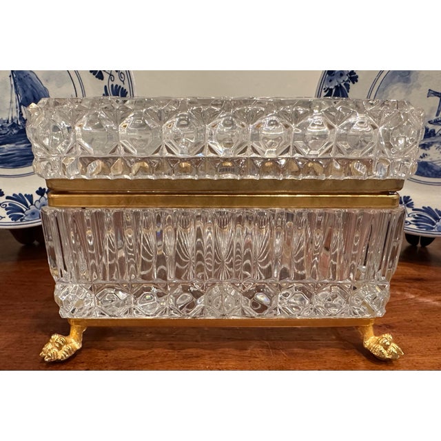 Beautiful vintage cut crystal footed box. This box just glistens in person. Gorgeous cut crystal with metal rims and feet....