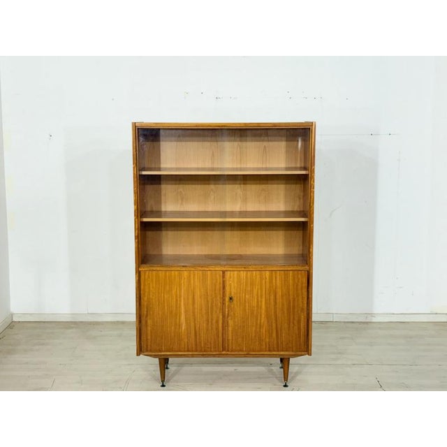 For sale is a particularly beautiful highboard from 1966, distinguished by its high-quality walnut veneer and timeless...