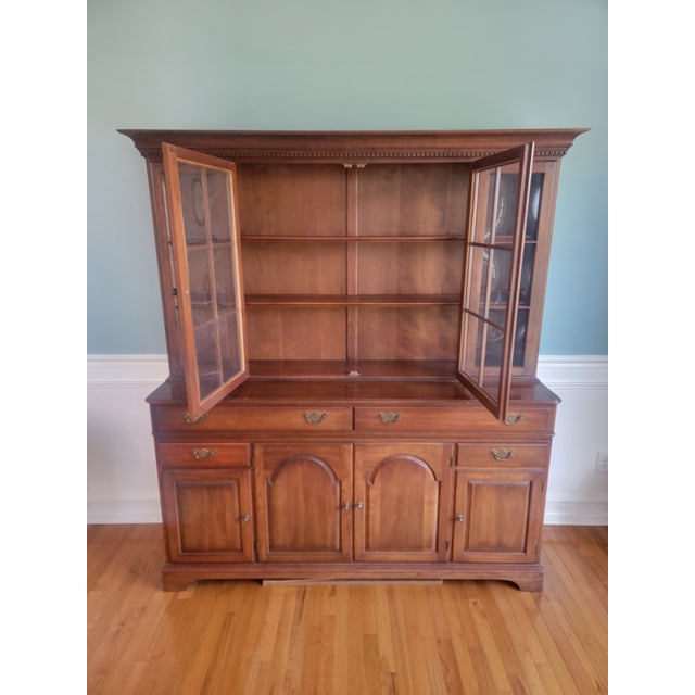 The magnificent crown jewel of traditional dining rooms, this 1971 vintage two-piece china cabinet hutch by Pennsylvania...