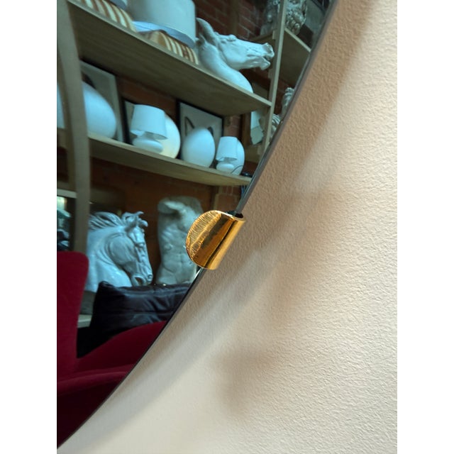 A captivating Italian concave wall mirror from the 1970s, distinguished by its deeply curved surface and blue-tinted...