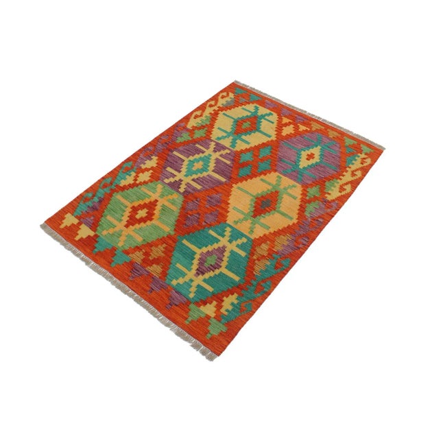 Add a touch of elegance to your home with this casual chic hand woven Tribal Kilim wool rug. Constructed on a loom by...