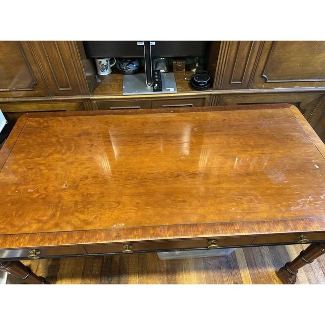 Elevate your home office or library with this exceptional vintage Baker Furniture Grandview writing table. Meticulously...