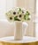 Crafted in Italy, this hand-built ceramic vase has a sculptural silhouette. The textured gold finish is enhanced by a...