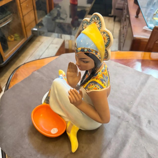 This elegant Ronzan porcelain figure represents the peak of mid-century Italian ceramic artistry, characterized by its...