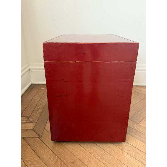 This vintage red lacquered storage chest is a versatile piece that adds both function and character to any space. Finished...
