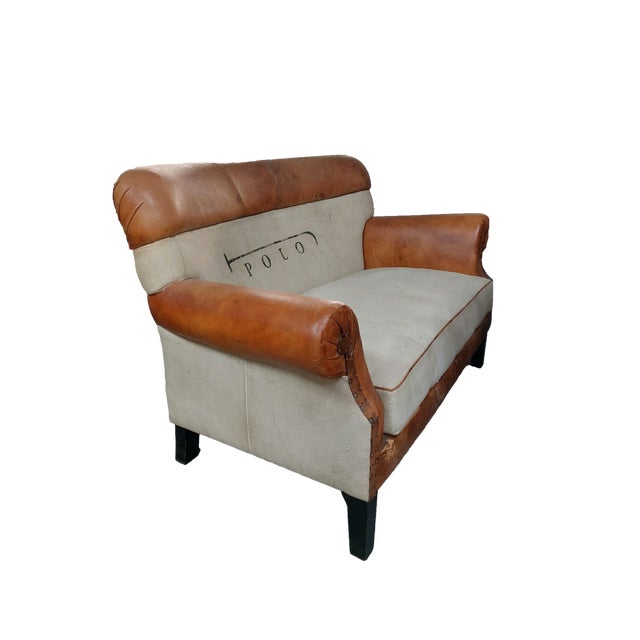 This vintage-style 2-seater sofa features a faux leather and fabric frame. It's a stylish, functional, and comfortable...