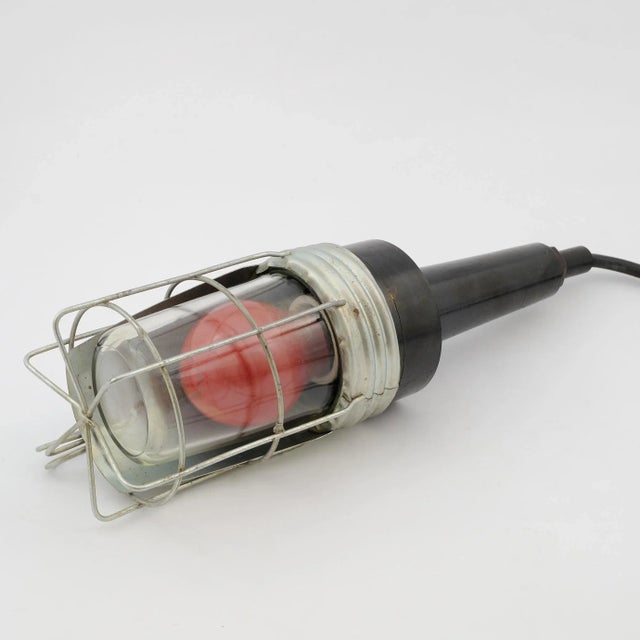 This workshop lamp was made by ESC in former Czechoslovakia in the 1970s. It is a very robust piece with a 5-meter long...