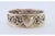 Silver Napkin Ring with Raised Floral Motifs and Monogram Card, in Good conditions. Designed 1890 to 1919