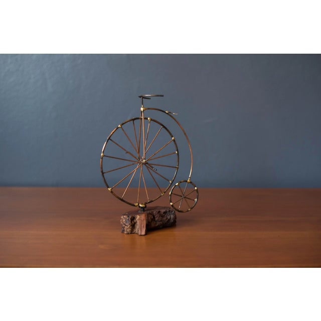 Mid-Century Modern studio art high wheeler bicycle sculpture circa 1970's. This piece is crafted of mixed metals mounted...
