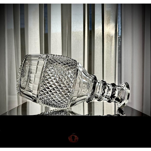 A refined French or Franco-Belgian cut crystal magnum decanter, dating to circa 1930. This elegant example features a...