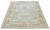 This hand-knotted wool rug has a light blue background adorned with multicolor accents in an all-over design. This rug...