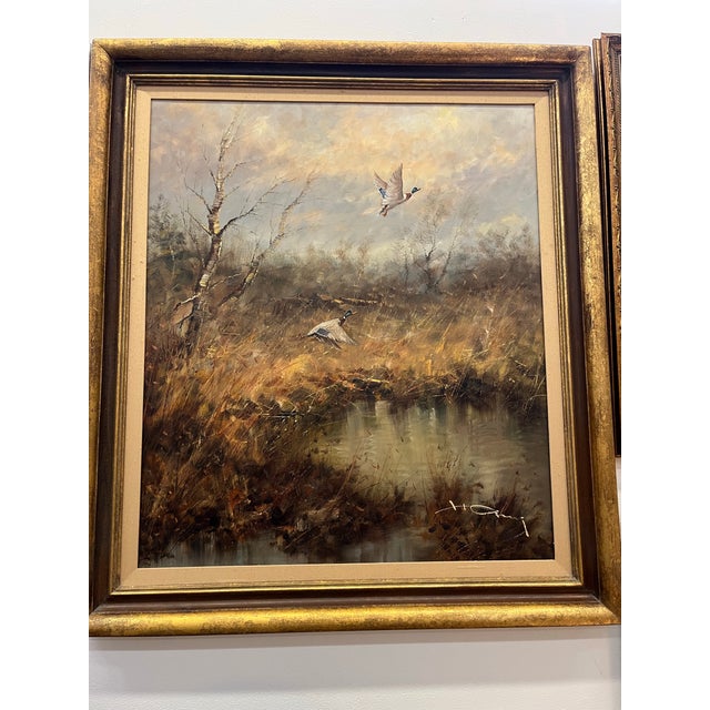 Oil painting of marsh scene with birds in flight by Hans Hansung 1937