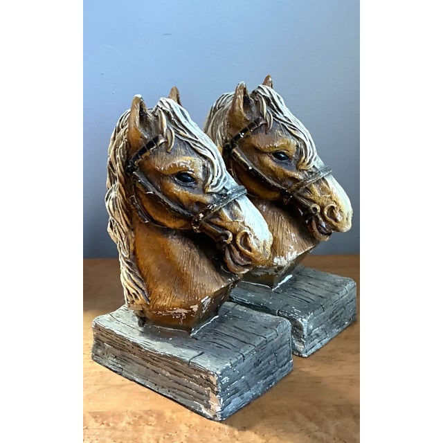 This pair of vintage horse head bookends brings mid-century charm to any bookshelf or desk, each sculptural head hand-cast...