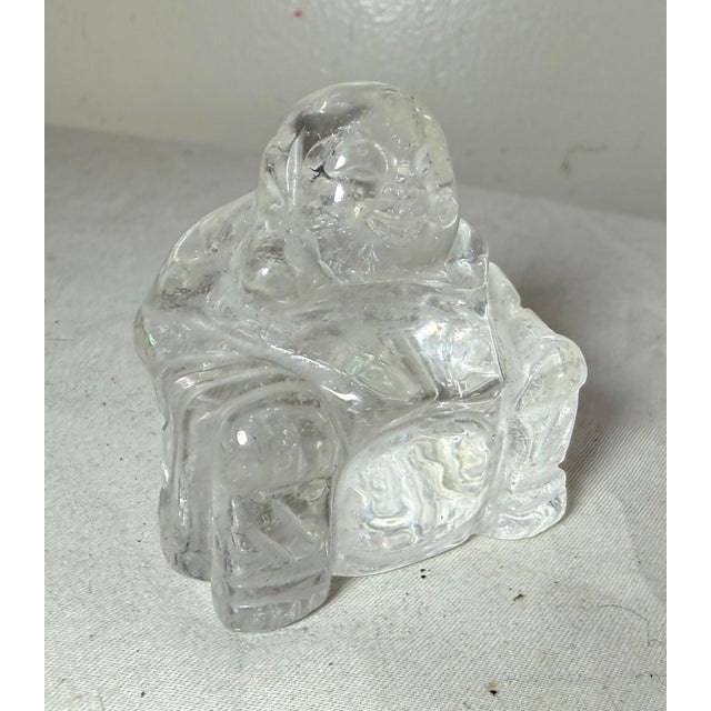 Up for sale is a lovely antique hand carved Chinese clear rock crystal Buddha sculpture. This intricate and detailed...