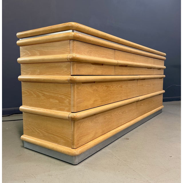 A signed and labeled Jay Spectre for Century Furniture dresser in bleached/limed oak, featuring the designer’s signature...