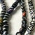 African Early 20th Century Venetian Feather Striped Skunk Thousand Eye Millefiori African Trade Glass Beads For Sale - Image 3 of 11