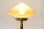 This glass and nickel-plated brass table lamp dates to 1909. European Plug (up to 250V).The wiring of this item may be...