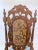 Armchair made in the Baroque style, decorated with decorated with artistic hand carvings and the upholstery is falling...