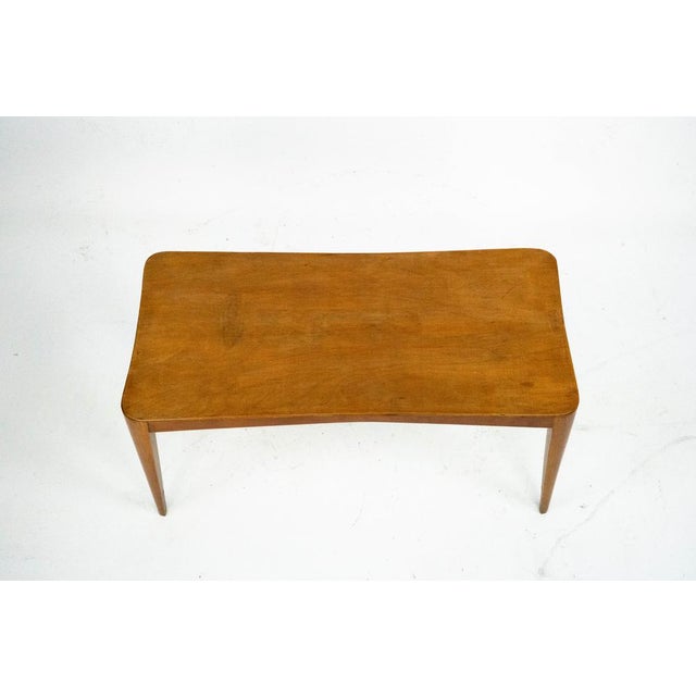 Elegant Italian Mid-Century coffee table from the 1950s, crafted in solid wood with a warm honey-toned finish. The...