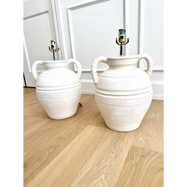 Impactful and rare pair of sculptural plaster table lamps by S+Mind, signed and dated 1987 and hand made in Denmark. (The...