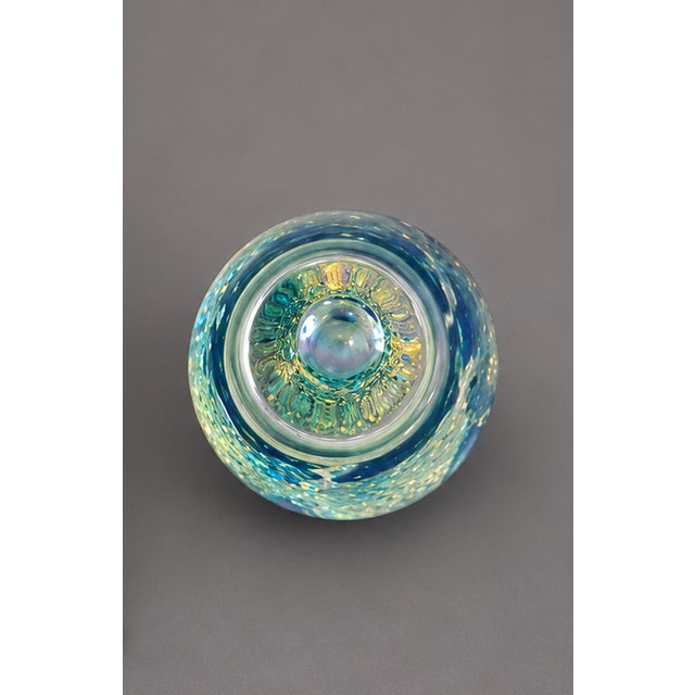 Bring a stunning splash of color to your home or office with this beautiful hand blown art glass paperweight featuring...