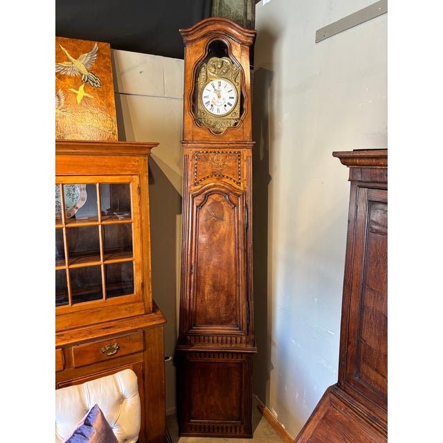 Louis XV Provincial walnut regulateur, or tall case clock, made in Lyon, France, around 1760. Constructed in 2 sections...