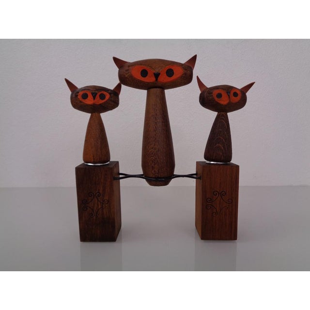 Corkscrew, bottle opener and cork made from oak in the shape of a cat from the 1960s. The cat ears were made of leather.