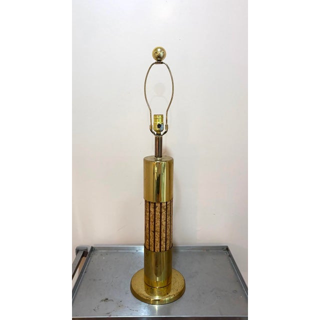 1950s-60s Russell Wright style brass/cork post table lamp. Some mild patina to metal in a few spots as shown. Otherwise...
