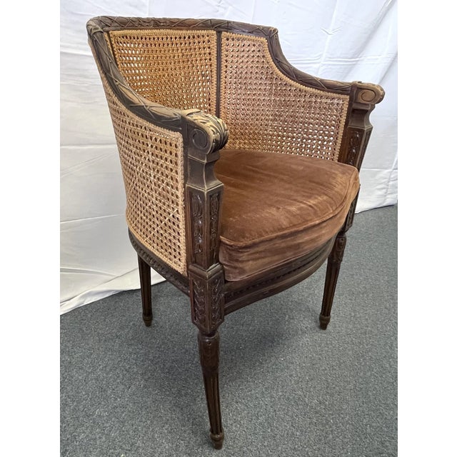 Great little French cane chair from the early 20th Century. The pretty chair has tons of character from the carved wood...