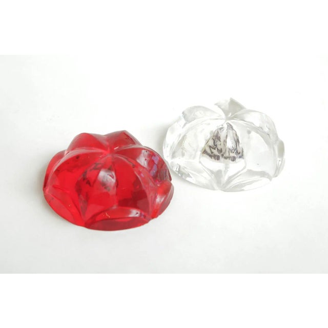 This pair of Norman Mercer hallmarked lucite orb flower paperweights have the original sticker on the bottom that states...