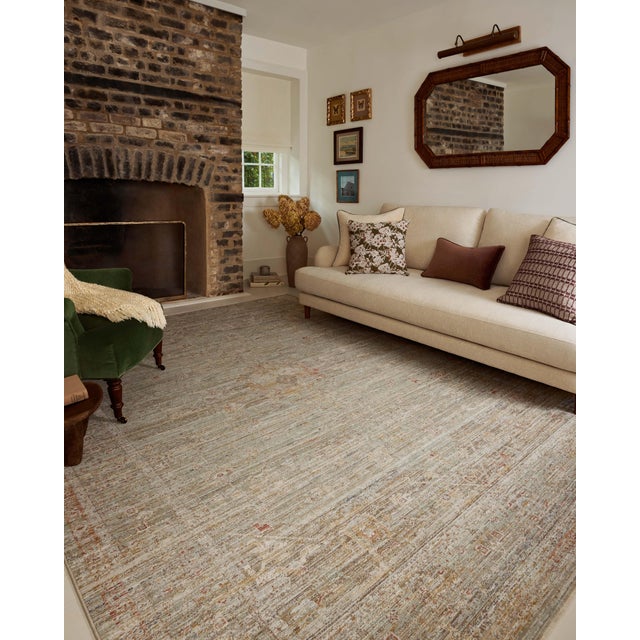 The Ida Collection from Chris Loves Julia x Loloi is a vintage-inspired area rug with a soft, subtly textured pile similar...