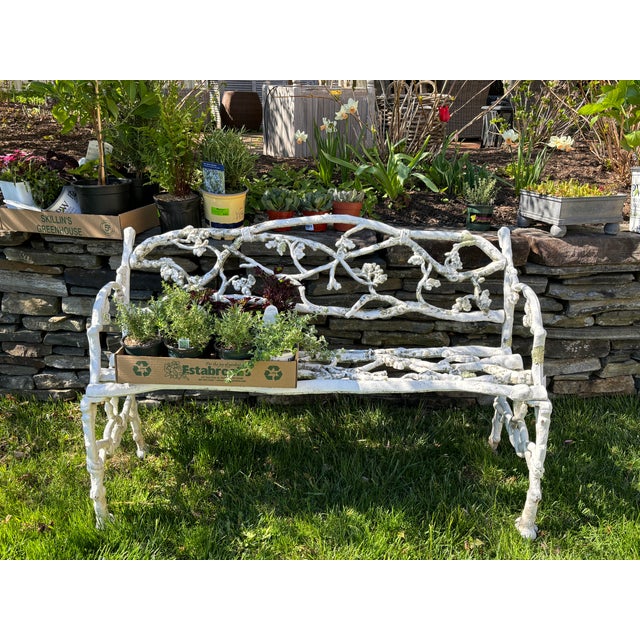 Victorian cast iron bench with serpents intertwined on the sides and twigs and foliage on the seat, back, and legs. Very...