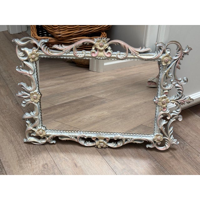 Ornate open patterned floral painted wall mirror. Midcentury gold toned mirror hand painted and modified with accents of...