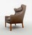 We are offering a special Danish Modern vintage leather high-back armchair, an iconic design classic from the mid-century...