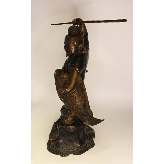 Japanese bronze of Ebisu, The God of Luck, fishermen, & prosperity, circa 1912-26. Antique, likely Taisho era. He holds a...